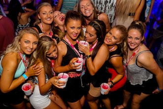 Girls in a Surfers Paradise nightclub celebrating Schoolies Gold Coast on a party tour