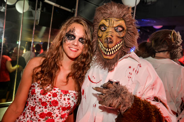 Halloween party girls dressed as spider girl and boy dressed as warewolf