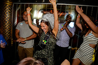 bride to be partying and dancing with her arms in air