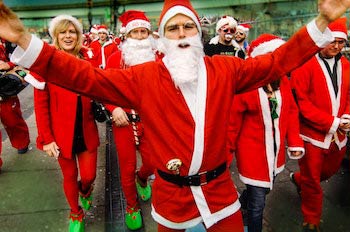 Red dressed Santas men and women