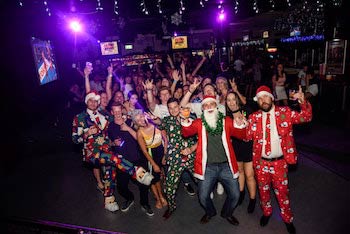 Bunch of people dressed up as Santa Claus