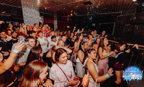 mates messing around at cocktails nightclub on Down under party tour